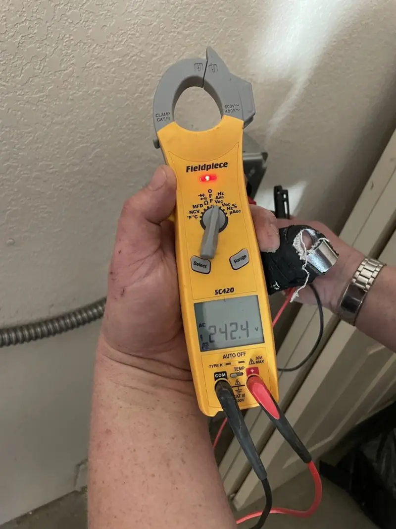 Voltage testing with clamp meter during Whole House Surge Protector in Mendham